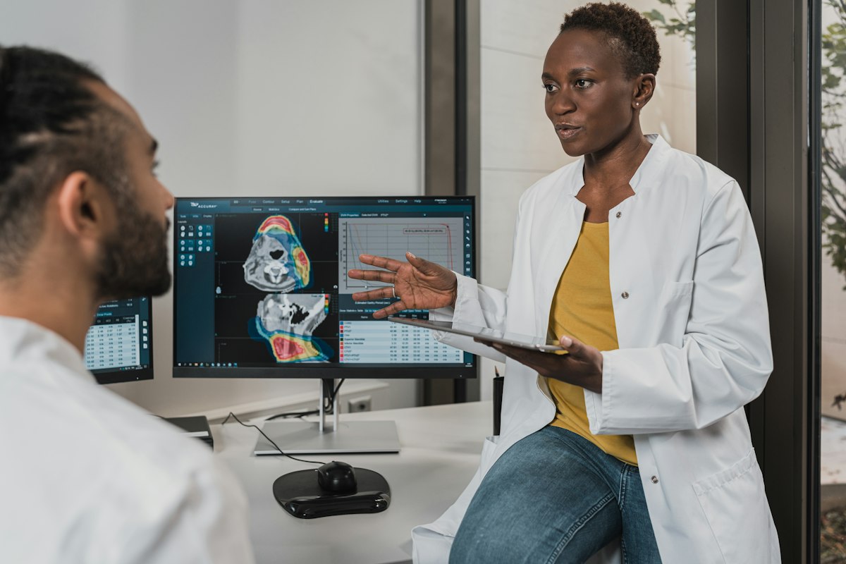 Clinician with stethoscope listening attentively