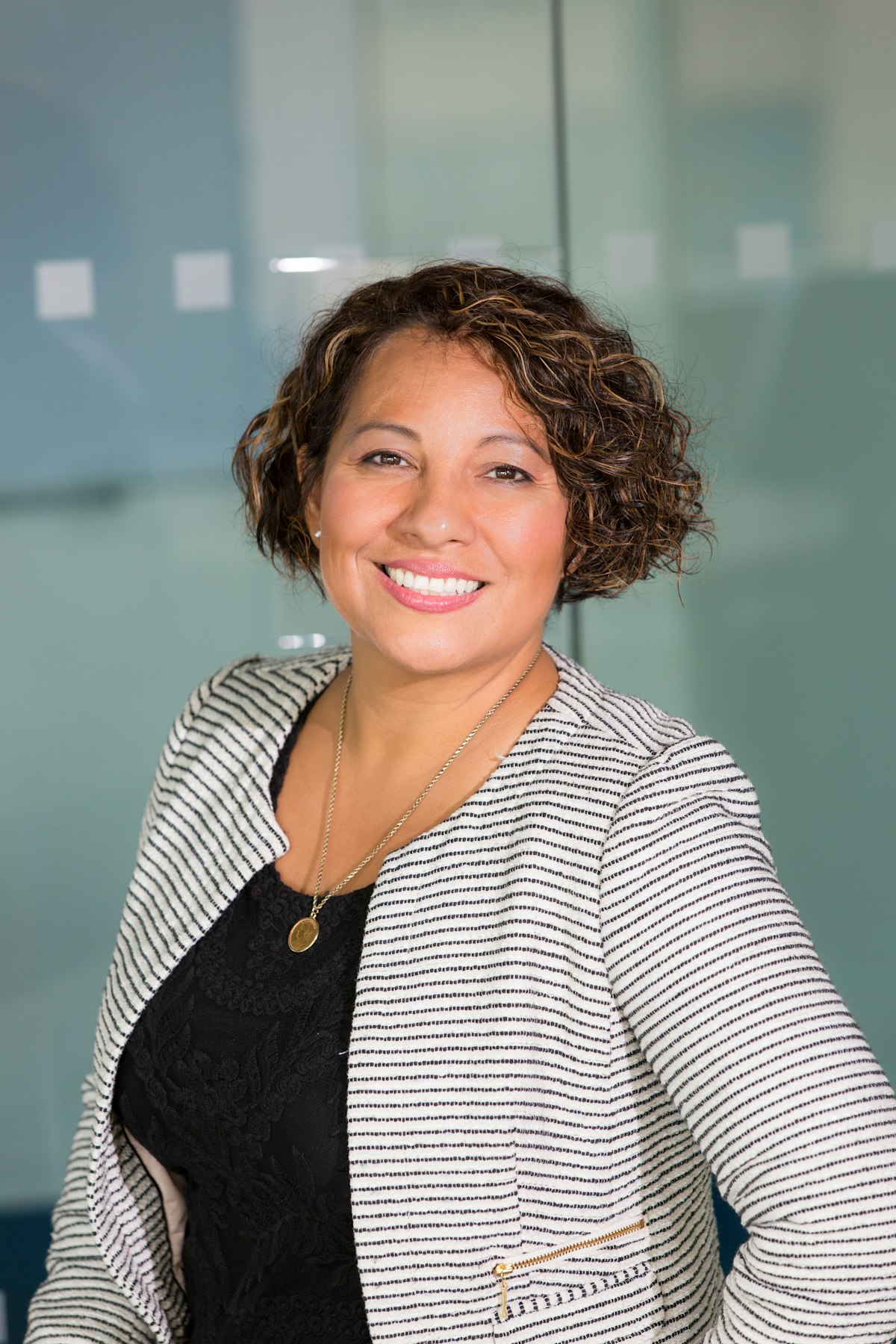 Black female clinician smiling at the camera